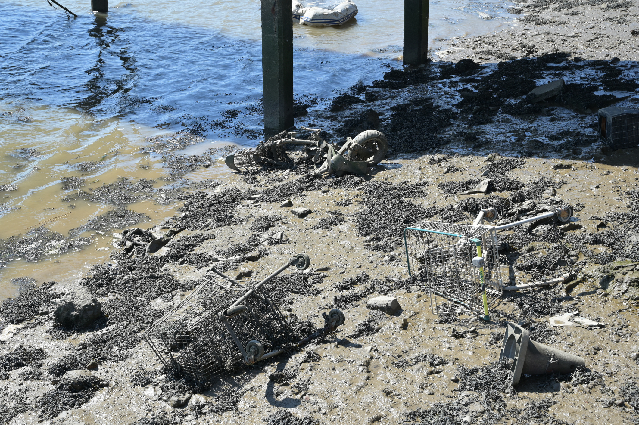 Fly tipping and illegal dumping on the banks of the River Medway in Kent